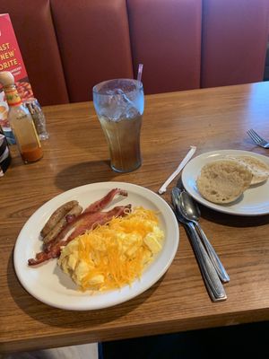 55+ egg scramble with bacon, sausage, english muffin