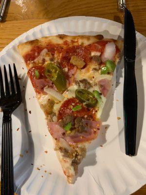 Supreme pizza slice (no olives jalapeño subbed)