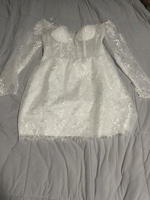 The dress I received, white breast pads being front and center. Material nothing like the picture on website.