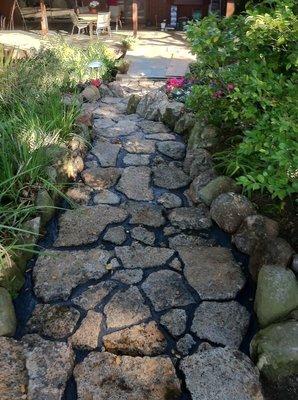 Rock steps to Beautiful deck to koi pond.