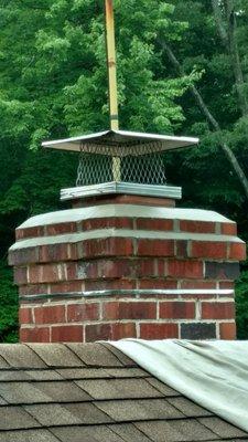 Chimney that Hanover Chimney Sweeps LLC replaced crown and drip edge.