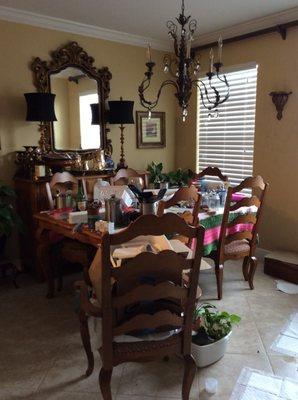 My kitchen spread out over my dining room table for lack of countertops. Thanks Millenium Tops for your dishonesty!