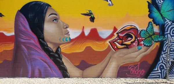 Tucson Computer mural depicting indigenous woman with birds and flowers