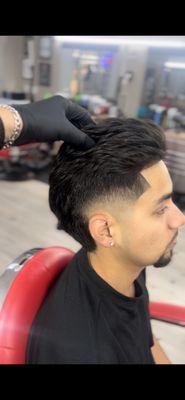 Burst Fade w enhanced corners to allow it to grow back fully , his previous barber had pushed him back just a little