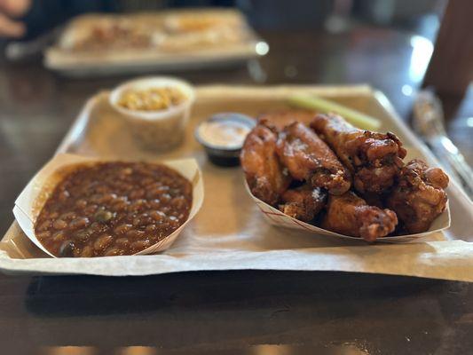 Smoked wings baked beans and corn