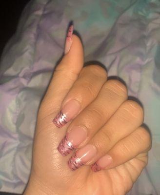 I asked for acrylic with a pink French tip with zebra stripes. In total it was $55. So hot