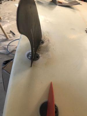 Customer came in with broken fin box. Filled in with foam, resin, fiberglass. Sanded down, good as new!