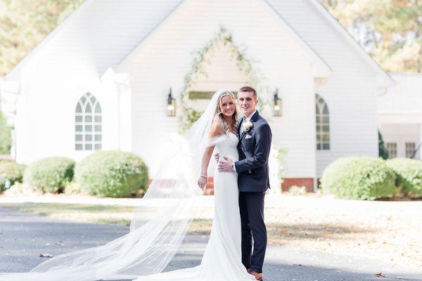 Rod and groom in front of Evergreen Chapel