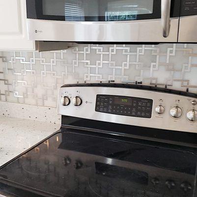 Tile backsplash installation.