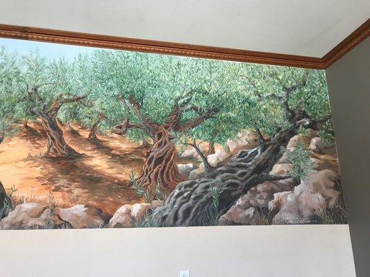 The stunning mural inside of Mar Saba Olive Oil's tasting room represents olive orchards.