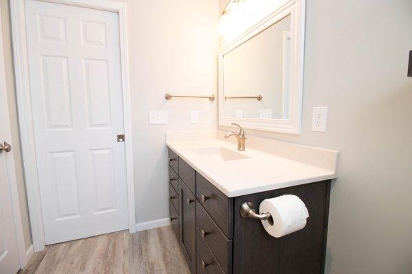 Bathroom remodel vanity with LVT flooring.