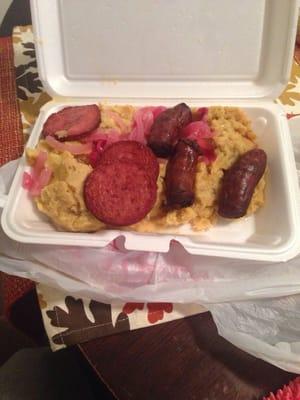 Mashed plantains with red sautéed onions along with fried salami and sausage(longaniza).