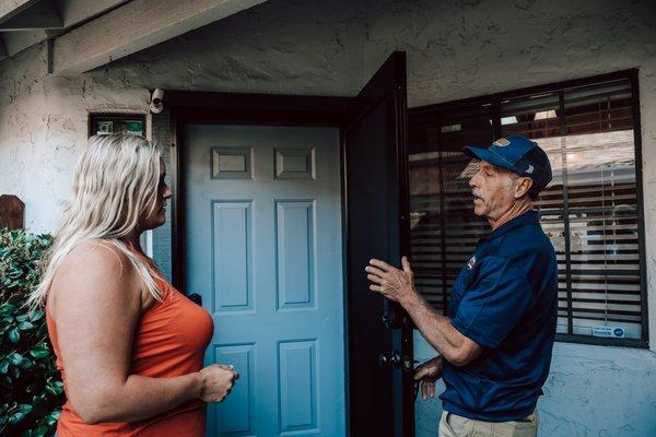 Technician demonstrating door to customer