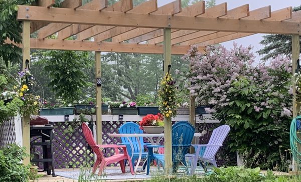 Who wouldn't enjoy that first cup of coffee in the morning on this deck with pergola surrounded by songbirds!