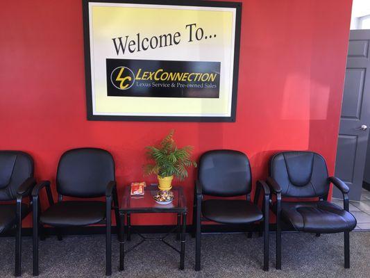 Comfortable waiting area with snacks and candy.