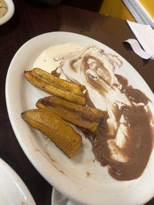 Fried plantain with beans and cream. Beans are the best of my entire meal.