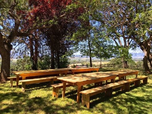 Our 10' farm tables and 10' benches, set up for a rehearsal dinner at Arrowhead Ranch.