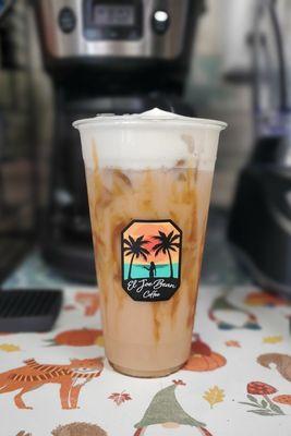 Iced Chai Latte with cold foam and caramel drizzled cup