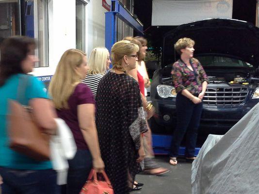 Women attend car clinic coordinated by AZ Media Maven and client, a local garage.