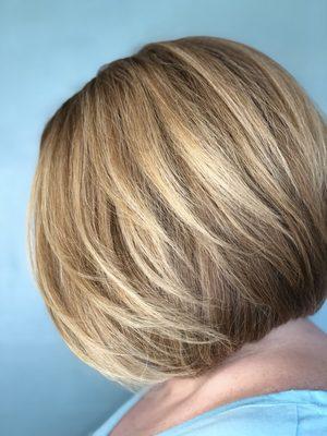 Root touch-up with golden beige glaze. Finished with a razor bob.