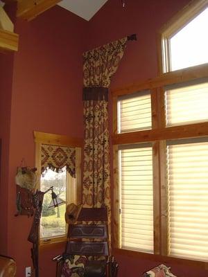 South western style side panel on challenging window with coordinating valance in side window.