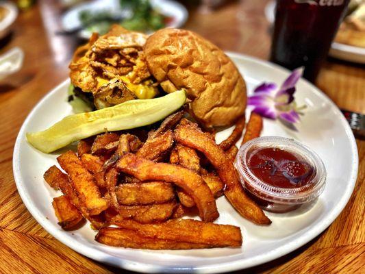 Outlaw BBQ Burger, with house made BBQ sauce. Crispy onions and smoked Gouda cheese. Sweet Potato fries! Must get...