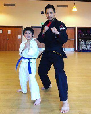 Sensei Jason promotes student to blue belt