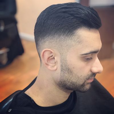 Tight fade with a longer textured top