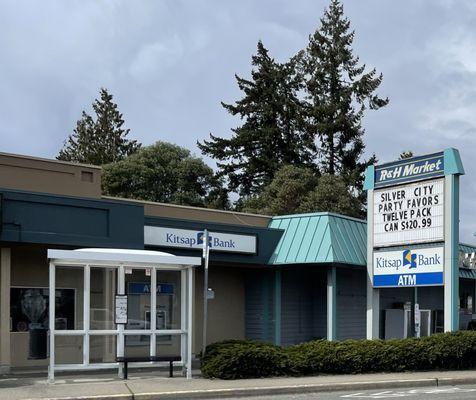 exterior or r & h market from kitsap way bus shelter