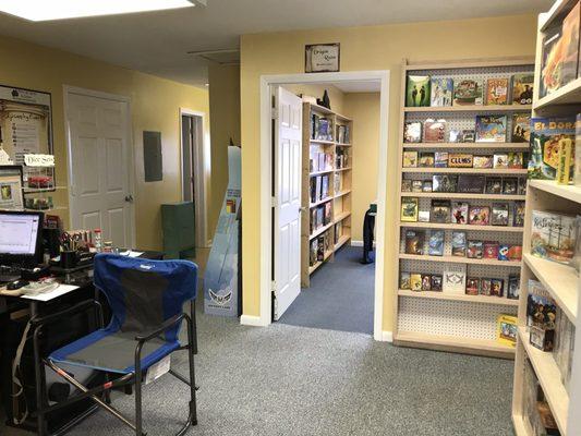 Some two-player games, small card games and tarot cards are next to the entrance to the Dragon Room. Card sleeves just inside the front door