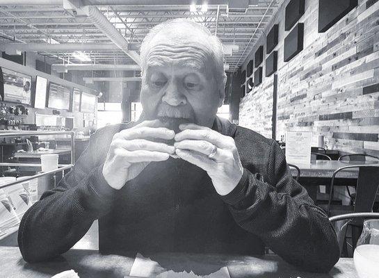 Now that's a man enjoying a burger.