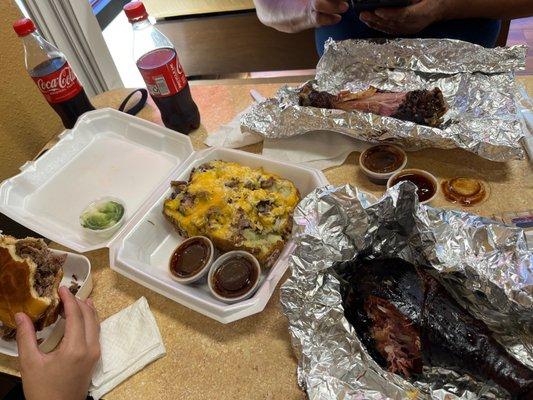 Loaded brisket potato, turkey legs, Brisket Sandwich