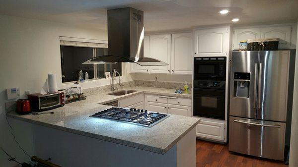 New range hood to go with new range, sink , faucet, dishwasher, and recessed lighting!