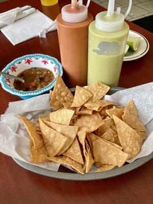 Complimentary chips and salsa- green is mild, and both red salsas are hot!