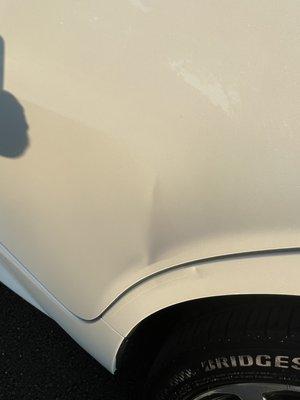 Dent on side of door.