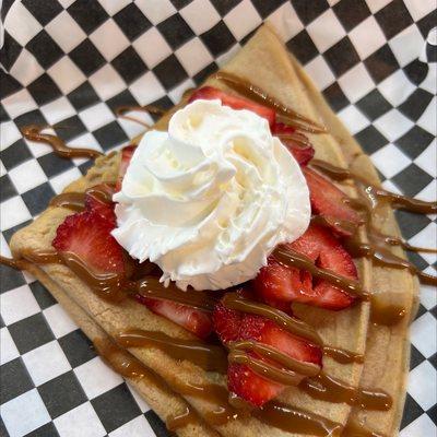 Crepe with strawberries and dulce de leche.