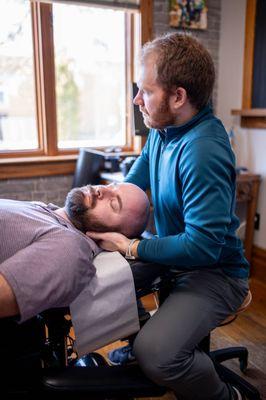 Setting up a chiropractic cervical adjustment.