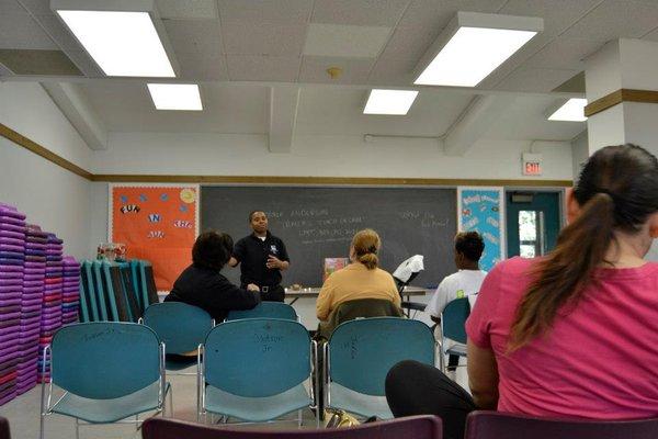 Owner Tamia S. Anderson teaching about the benefits of receiving massages!