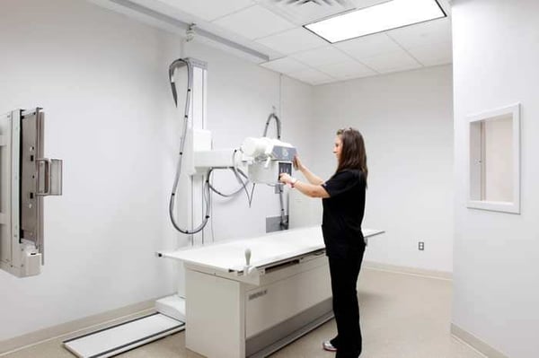 X-Ray machine being operated by licensed radiographers