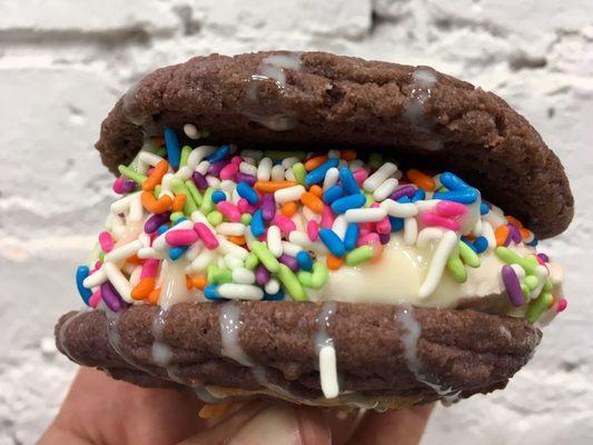 Ube coconut cookie with vanilla ice cream, sprinkles and condensed milk drizzle.