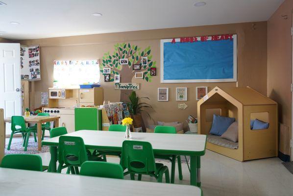 This is a side view of our 3-4 year old's classroom. We have a reading nook in here and a small kitchen for playtime.