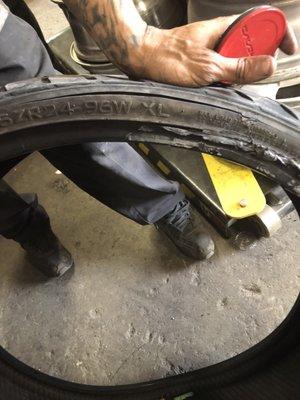 Look at the slashed tire your shop sent me home to drive around in. Awful and sloppy service you did me.