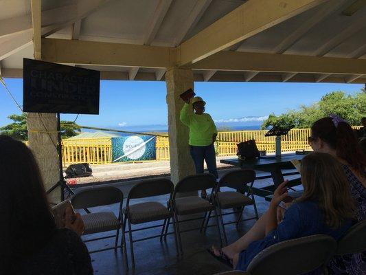 Pastor Lani, playing the part of a construction worker while teaching that we are "all under construction!"