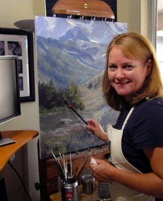 Red Sky Gallery artist Nancy Romanovsky, at work in her studio.