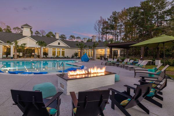 pool deck with firepit and lounge chairs