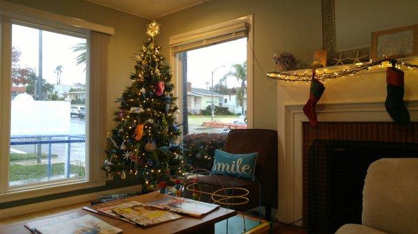 Comfy waiting room decorated for the holidays.