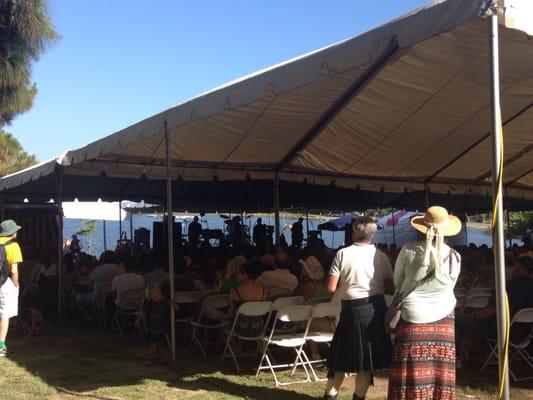 Standing room only by the large concert tent- great view of the lake in the middle of the park in background.