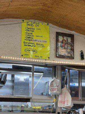 Menu on wall, no prices?