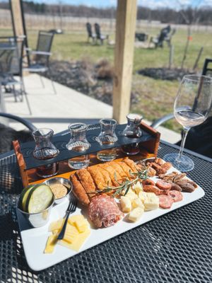 Flight of wines + cider with a glass of Peach Riesling