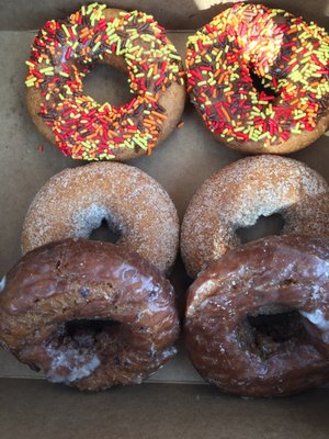 Sprinkle, pumpkin, and blueberry doughnuts